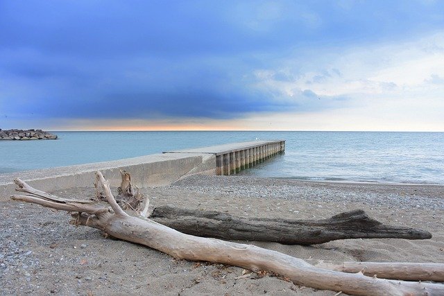 sun, sunset, water, flow, waters, rhine, riverbank, driftwood, stony, nature, heaven, clouds, mood