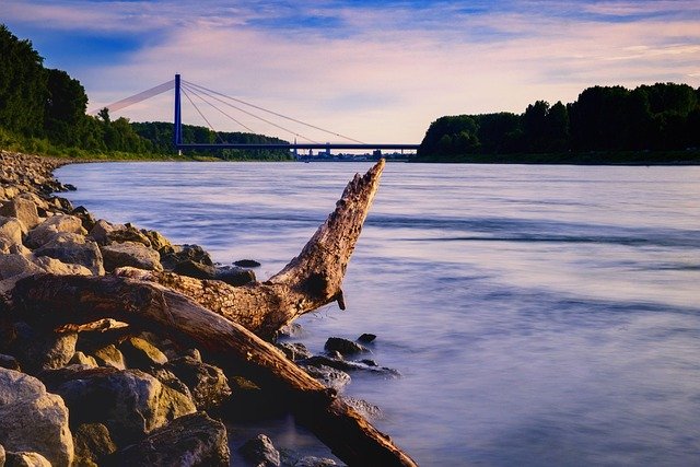 water, nature, flow, waters, rhine, bridge, rheinbrücke, riverbank, stones, driftwood, stony, heaven, clouds, mood