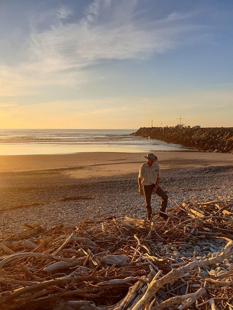 beach, driftwood, man, sunset, silhouette, sea, ocean, landscape, evening, outdoors, nature, dusk, person